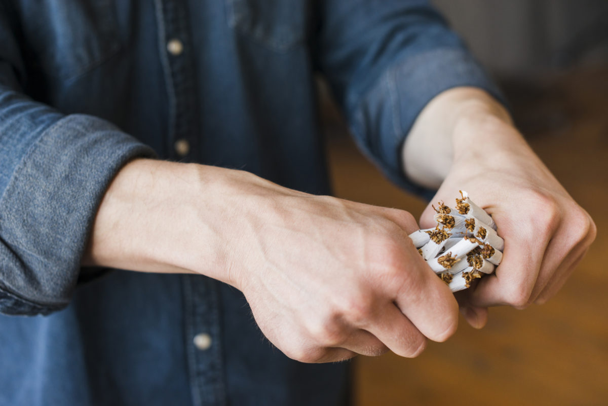 close-up-of-human-hand-breaking-bundle-of-cigarettes-1200x801.jpg